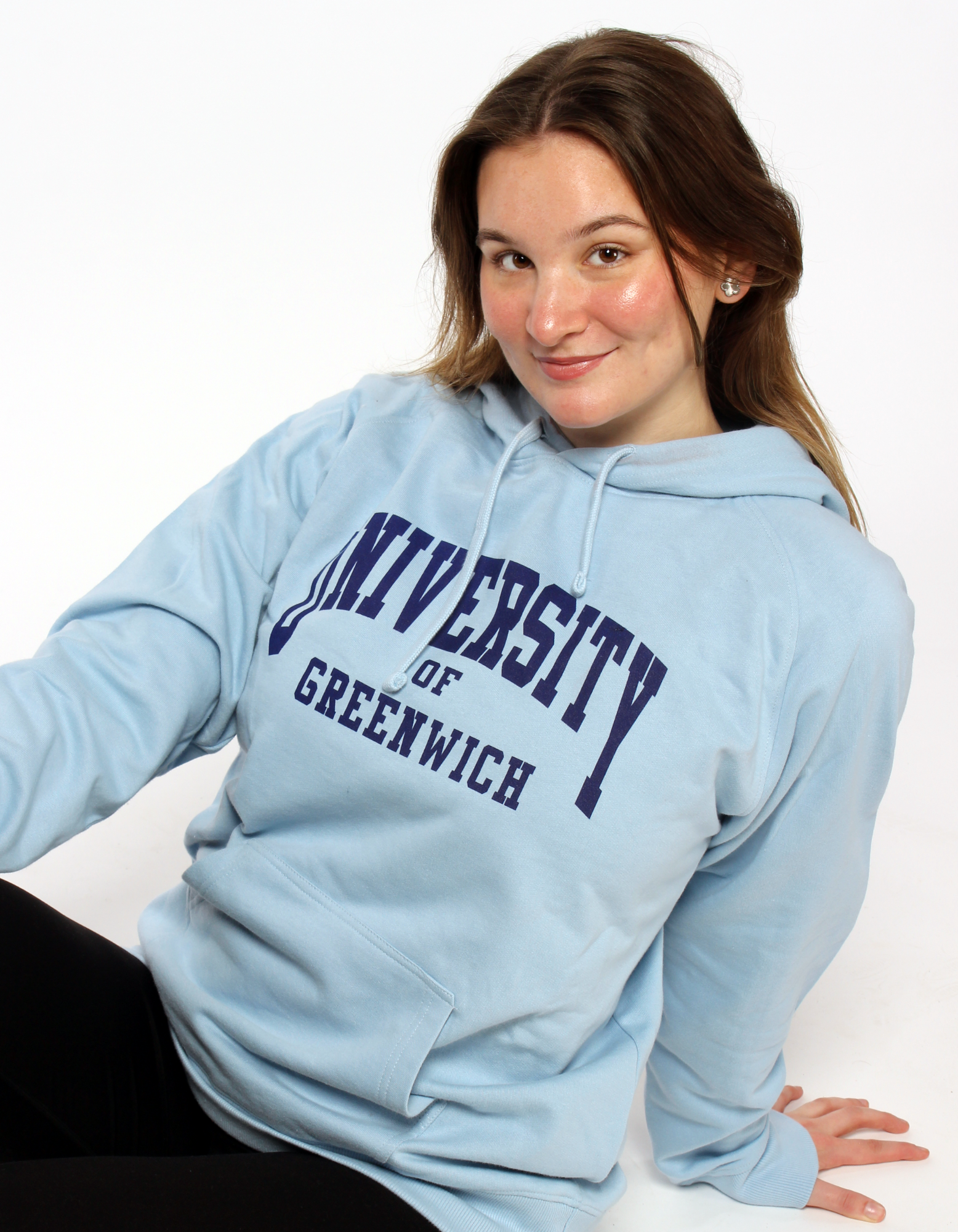 Image of a girl, wearing a blue hooded sweatshirt